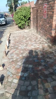 Cobble half brick paving  and tar surfacing
