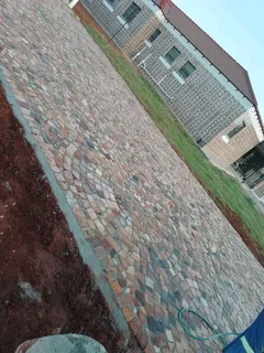 Cobble half brick paving  and tar surfacing
