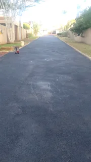 Tar surfacing  and  brick paving