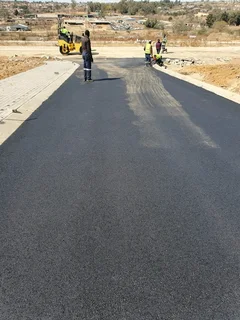 Tar surfacing  and  brick paving