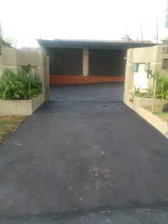 Tar surfacing  and  brick paving