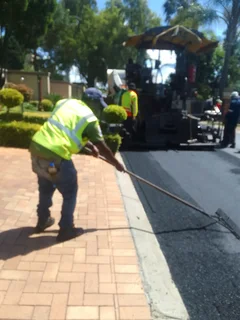 Tar surfacing  and  brick paving