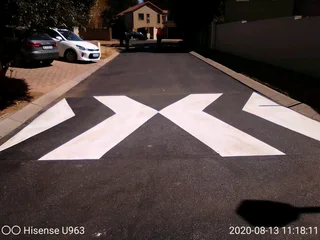 Tar surfacing and brick paving