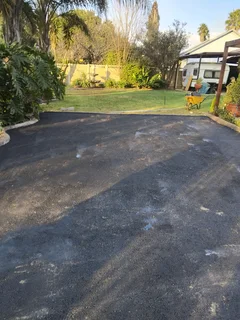 Tar surfacing and brick paving