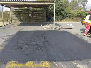 Tar surfacing and brick paving