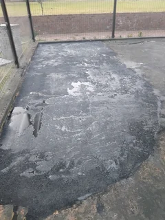 Tar surfacing and brick paving