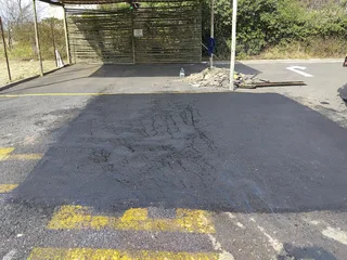 Tar surfacing and brick paving