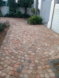 Cobble half brick paving and tar surfacing