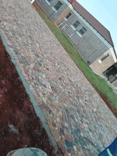 Cobble half brick paving and tar surfacing