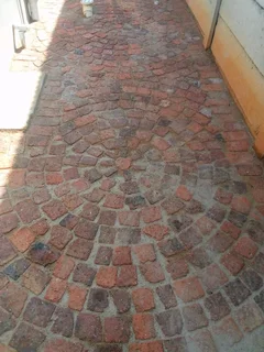 Cobble half brick paving and tar surfacing