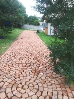 Cobble half brick paving and tar surfacing