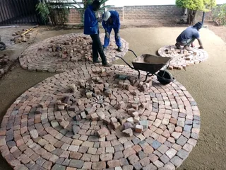Cobble half brick paving and tar surfacing