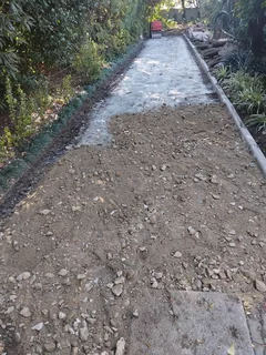 Tar surfacing and brick paving