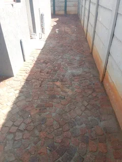 Cobble half brick paving and tar surfacing