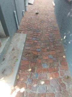 Cobble half brick paving and tar surfacing
