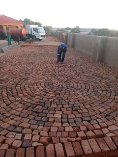 Cobble half brick paving and tar surfacing