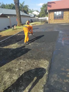 Tar surfacing and brick paving
