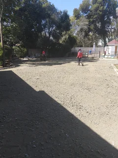 Tar surfacing and brick paving