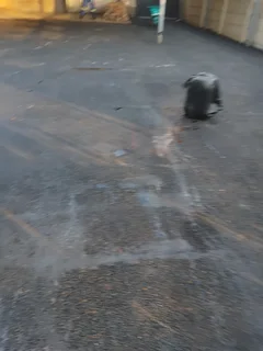 Tar surfacing and brick paving