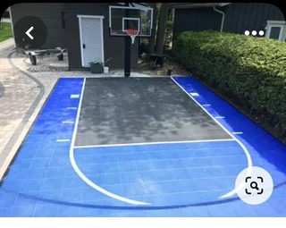 Tar surfacing and brick paving