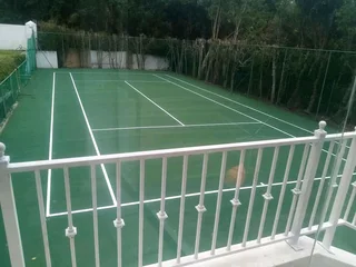 Tar surfacing and brick paving