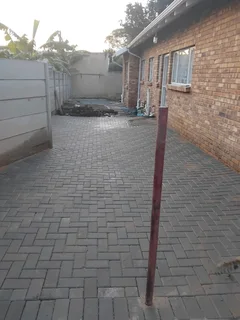 Brick paving and tar surfacing