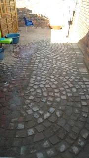 Cobble half brick paving and tar surfacing