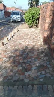 Cobble half brick paving and tar surfacing