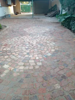 Cobble half brick paving and tar surfacing