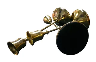 Set of three graduated brass taper candlesticks