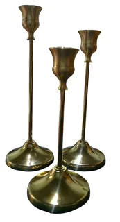Set of three graduated brass taper candlesticks