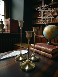 Set of three graduated brass taper candlesticks