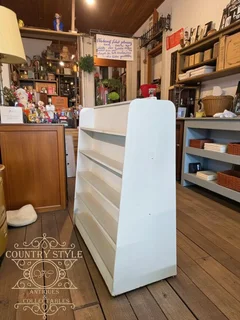 Vintage wooden display shelf "gondola" design.