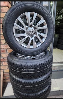 18inch Toyota Fortuner/Prado original mags with brand new 265/60/18 Dunlop Grandtrek A/T set R17500.