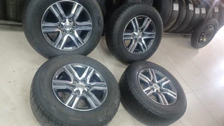 17inch Toyota Hilux/Fortuner OEM mags with used 265/65/17 Bridgestone Dueller A/T set R11000.