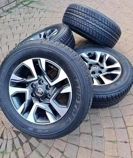 Toyota Fortuner/Legend 55, 18inch original mags with brand new 265/60/18 Dunlop AT25 set R17500.