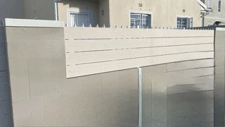 Nutec planks cladded on steel gates and boundary fence