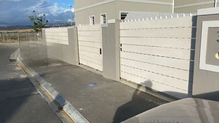 Nutec planks cladded on steel gates and boundary fence