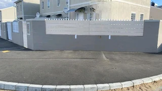 Nutec planks cladded on steel gates and boundary fence