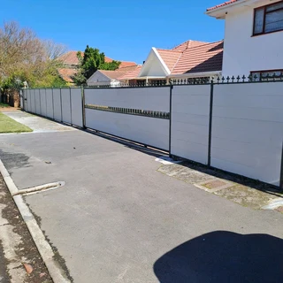 Nutec planks cladded on steel gates and boundary fence