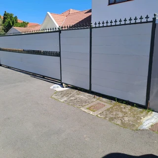 Nutec planks cladded on steel gates and boundary fence