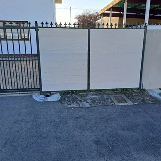 Nutec planks cladded on steel gates and boundary fence