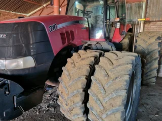 Case 310Jaar model 2009Met AutosteerUre 7200