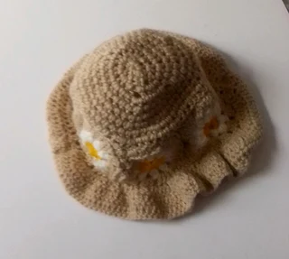 A daisy granny square bucket hat