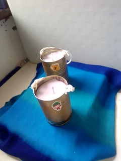 Scented lavendar candle in a tin with a hanging lantern string