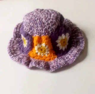 A purple daisy bucket hat