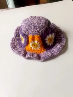 A purple daisy bucket hat