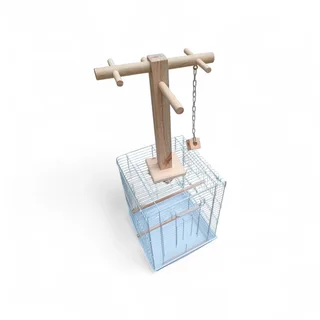Parrot play stand mounted on top of the cage
