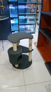 multi-level cat tree with scratching posts and an enclosed condo area.