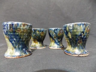 Set of Four Glazed Pottery Egg Cups